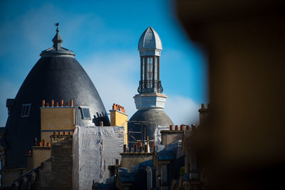 View of buildings in city against sky