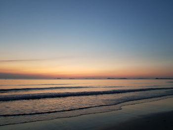 Scenic view of sea against clear sky during sunset