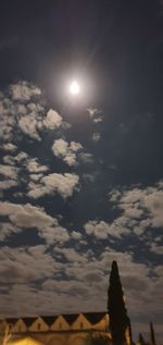 Low angle view of illuminated moon at night