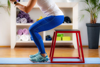 Woman using jumping stool during training