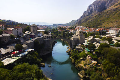 High angle view of river amidst buildings in town