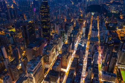 High angle view of city lit up at night