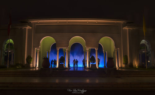 Interior of illuminated temple at night