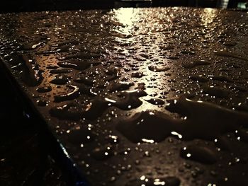 High angle view of raindrops on rainy day