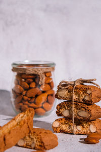 Traditional italian cantuccini cookies with almonds in glass jar. sweet dried biscuits. homemade l