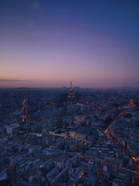Eiffel tower in city at dusk