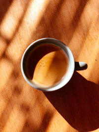 High angle view of coffee cup on table