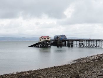 Pier over sea against sky