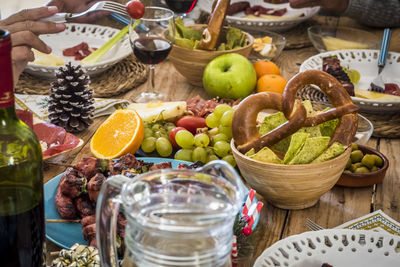 Various fruits in basket on table