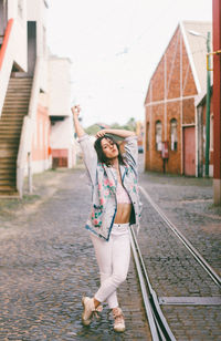 Portrait of smiling young woman standing in bus