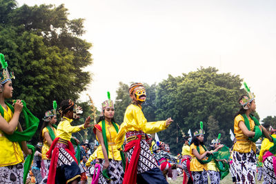 Group of people in traditional clothing during festival