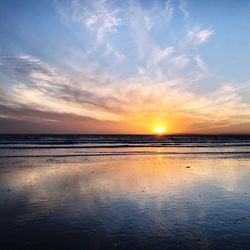 Scenic view of sea against sky at sunset