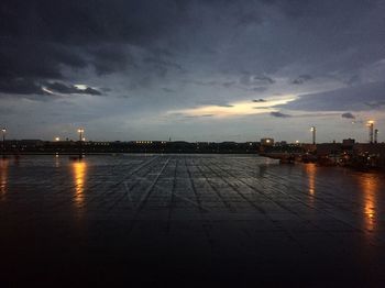 View of city at waterfront during sunset