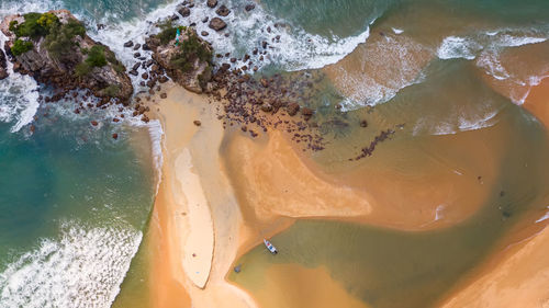 High angle view of surf on beach