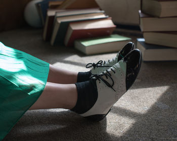 Low section of woman wearing canvas shoes