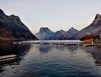 Scenic view of lake and mountains against sky