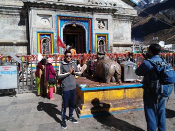 Portrait of man standing by temple