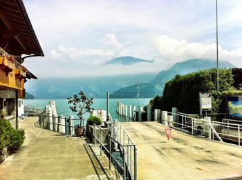 Narrow walkway along calm sea