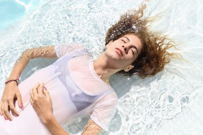 High angle view of woman swimming in pool