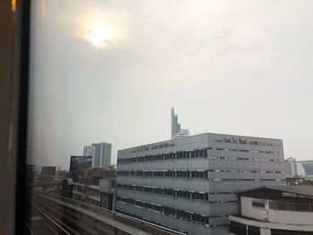 Modern buildings in city against sky