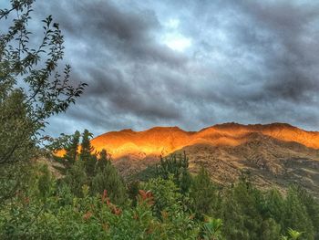 Scenic view of mountains against cloudy sky