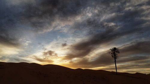 Scenic view of silhouette landscape against sky during sunset