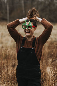 Happy woman wearing christmas glasses