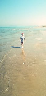 Full length of man on beach against sky