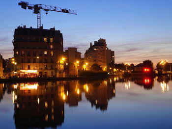 Reflection of illuminated buildings in water at night