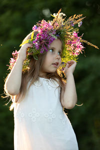 Beautiful little girl in a wreath