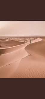 Scenic view of desert against sky