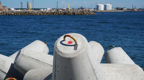 Nautical vessel on sea by harbor