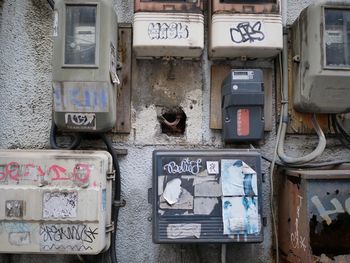 Electric switch boards on damaged wall