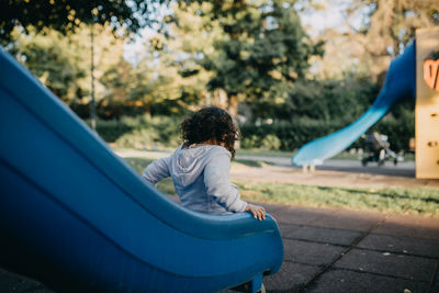 Low angle view of girl playing on playground