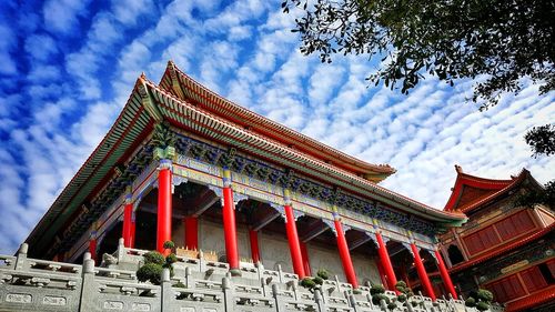 Low angle view of temple against sky in city