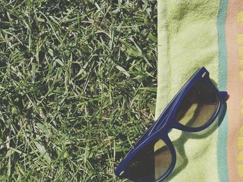 High angle view of sunglasses on grass