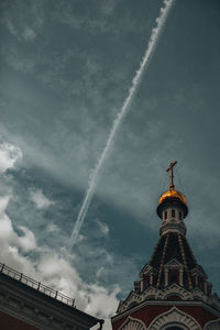 Part of the church dome against the background of a cloudy sky. toned photo