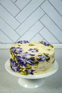 High angle view of purple flowers in plate on table
