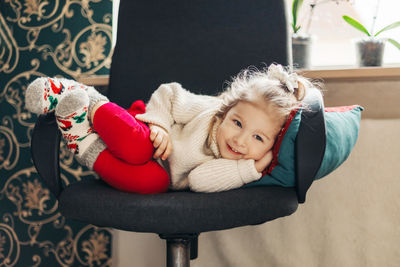 Portrait of cute girl playing with teddy bear