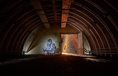 Rear view of man standing in abandoned building