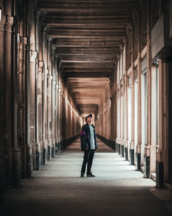 Man walking in corridor