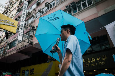 Full length of man standing in city