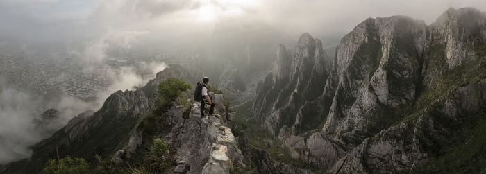 One man standing on a narrow edge at a high area in la huasteca