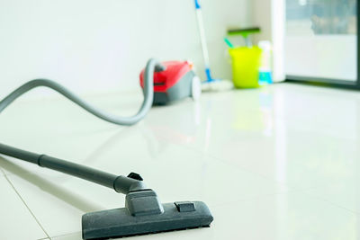 Close-up of vacuum cleaner on floor at home