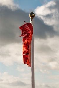 Low angle view of flag against sky