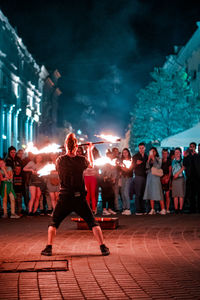 People enjoying music concert at night