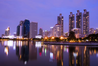 Reflection of buildings in city at night