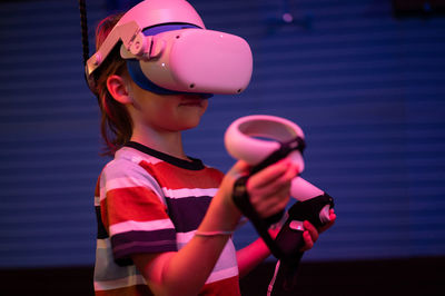 Vr game and virtual reality. kid boy gamer six years old fun playing on simulation video game