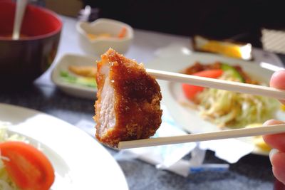 Close-up of chopsticks holding starter