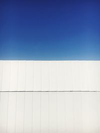 Low angle view of building against clear blue sky